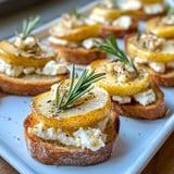 A plate of food with a slice of lemon on top.